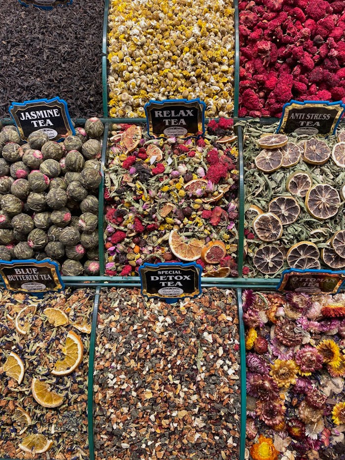 about-04 Colorful array of herbal teas and dried fruits in a market stall, perfect for health and wellness themes.